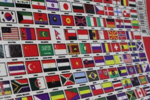 A grid of national flags from countries around the world, representing international cooperation.