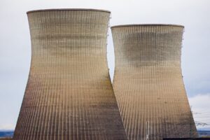 Two large concrete cooling towers standing at a nuclear plant site ahead of planned demolition.