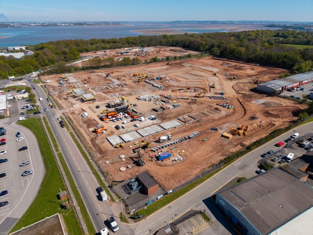 An aerial view of a large construction site being redeveloped for new building projects.