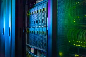 Rows of server racks and supercomputing equipment used for large-scale scientific simulation.
